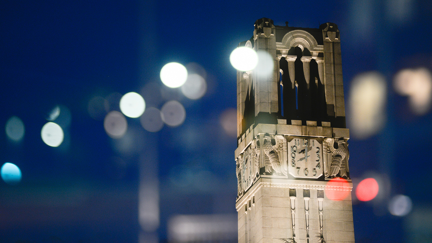 The NC State Belltower at dusk and night. Photo by Marc Hall.