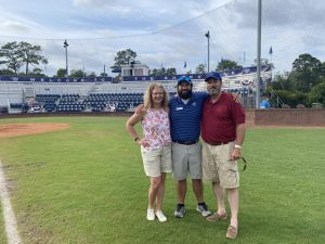 Allen Lusk with his family at the baseball field.